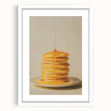 Abstract art print of assorted pastries in soft pastel shades, framed with a white mat, suitable for dining room decor.