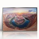 Framed acrylic landscape artwork showcasing vibrant canyons in shades of orange and blue, elegantly displayed with a sleek silver frame, perfect for modern home decor.