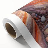 Desert landscape rolled canvas artwork showcasing vibrant orange and brown hues, depicting serene dunes under a clear blue sky, elegantly packaged in a protective tube.