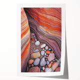 Desert landscape rolled print showcasing vibrant hues of orange and yellow, depicting a serene sunset over sand dunes, rolled in protective cardboard tube for shipping.