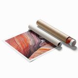 Desert landscape rolled print showcasing vibrant orange and beige hues, capturing the serene beauty of arid terrain, packaged securely in a protective cardboard tube.