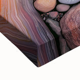 Close-up of a stretched canvas artwork showcasing a vibrant desert landscape, featuring warm hues of orange and yellow, accentuated by intricate details in the foreground. Ideal for home decor enthusiasts seeking nature-inspired wall art.