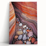 Stretched canvas artwork depicting a serene desert landscape with warm tones of orange and yellow, leaning against a neutral wall, perfect for home decor.