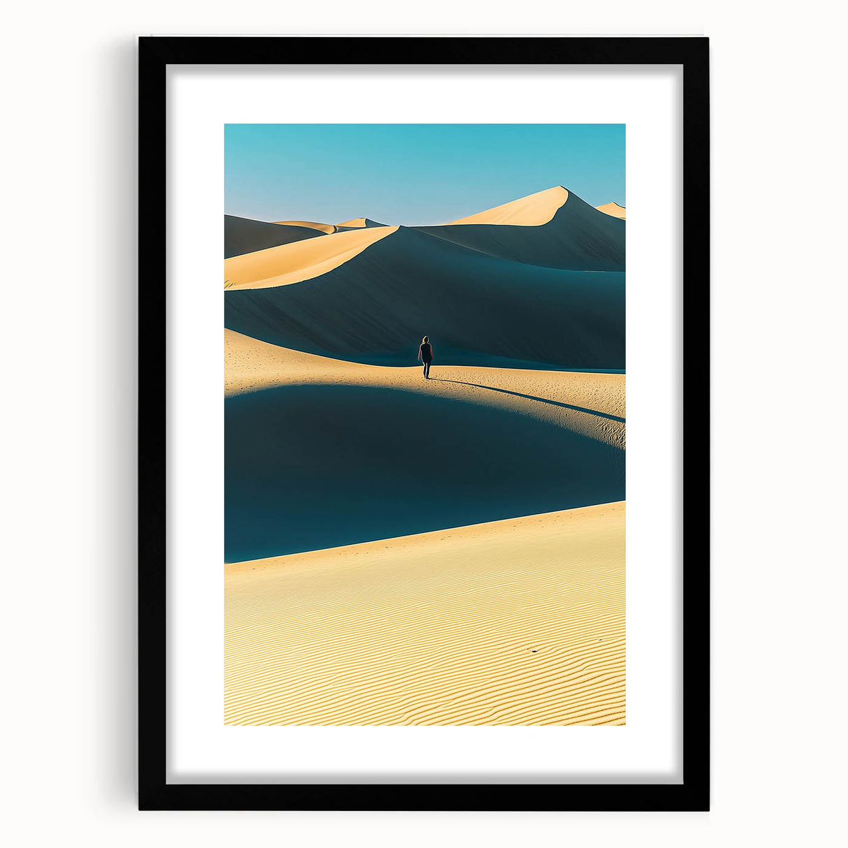 Framed landscape art print showcasing serene sand dunes in warm tones, presented with a black mat and frame, ideal for modern home decor.