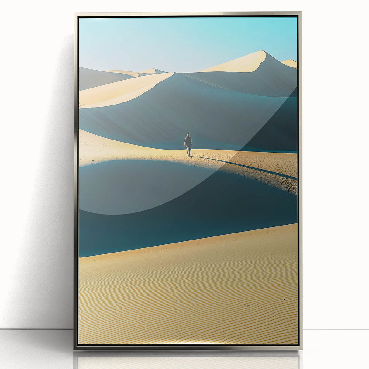 Framed acrylic artwork depicting serene sand dunes, showcasing soft beige and golden tones, elegantly displayed in a silver frame for modern home decor.