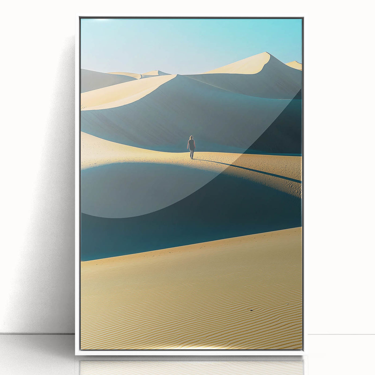 Framed acrylic artwork showcasing serene dune landscapes in soft beige and tan tones, elegantly presented with a sleek white frame, perfect for modern decor.