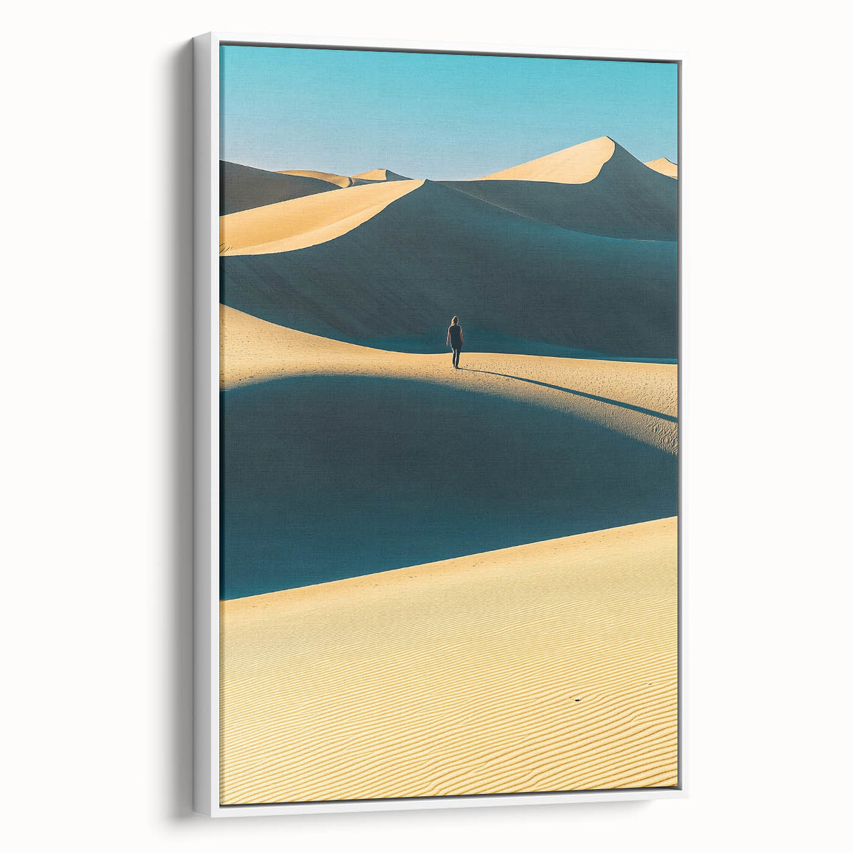 Framed canvas artwork showcasing serene desert dunes in warm tones, displayed from a side view against a neutral background, ideal for modern home decor.