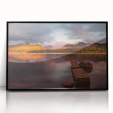 Large abstract wall art depicting a serene Cumbrian landscape in muted green and blue tones, framed in black acrylic.