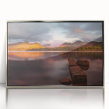 Large art print of a serene Cumbria landscape in England, featuring muted green and blue tones on a silver-framed acrylic.