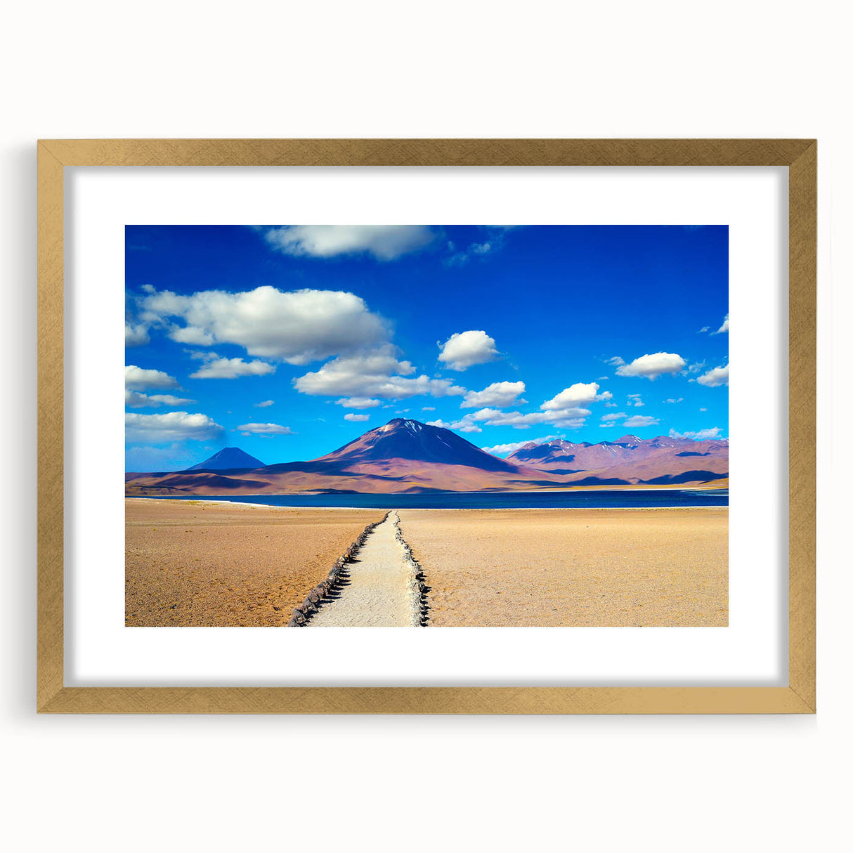 Extra large abstract art print of a Bolivian landscape in textured hues of gold and blue, framed with a mat.
