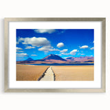 Textured abstract art print of a Bolivian landscape in muted earth tones, framed in silver, ideal for bedroom art.