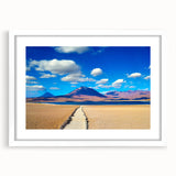 Abstract art print of a Bolivian landscape in muted earth tones on a framed white mat, ideal for dining room decor.