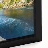 Close-up of textured black wall art depicting Connecticut scenery with colorful accents on a framed canvas.