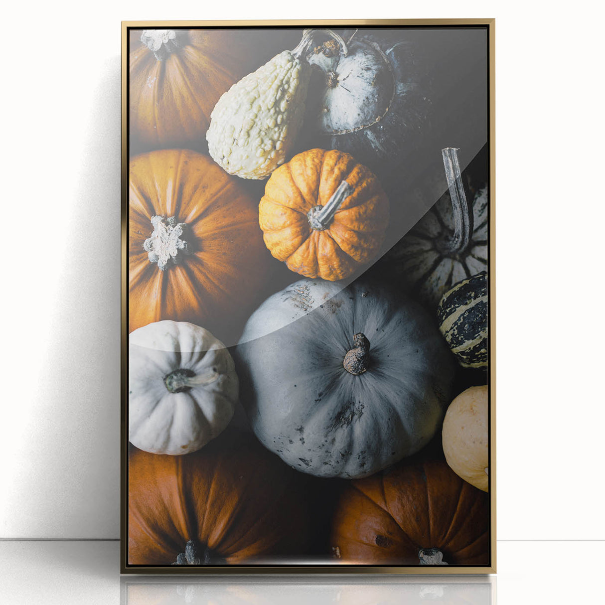 Large art print of a mid-century modernist fall scene in gold and orange tones on framed acrylic.