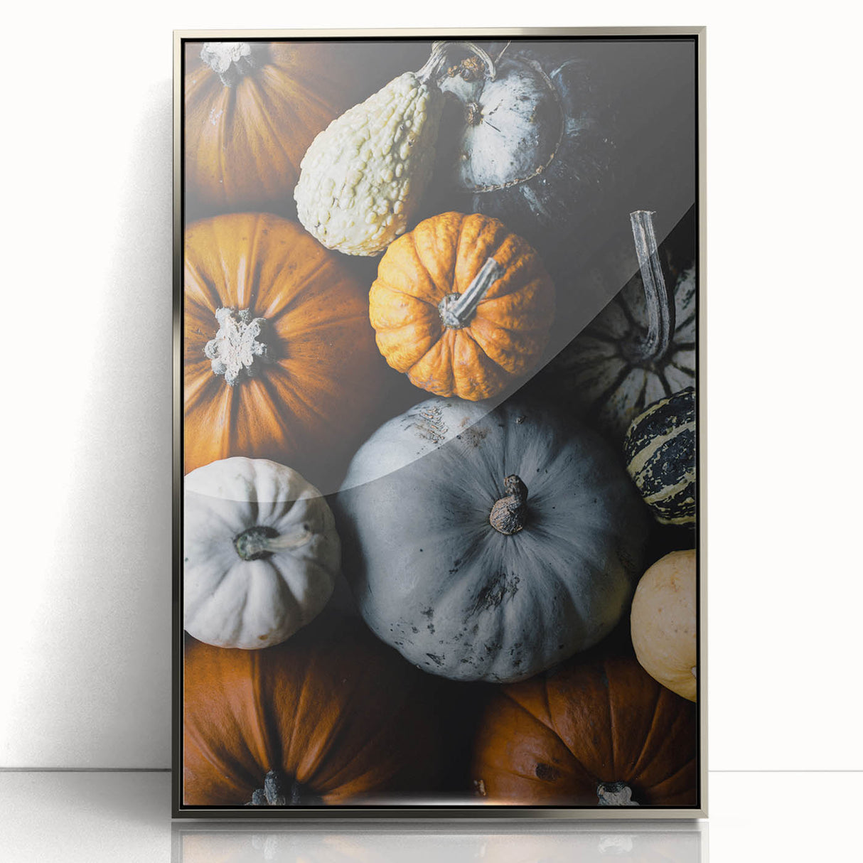 Mid-century modernist art depicting an abstract autumn scene in warm orange and brown tones, framed in silver acrylic.