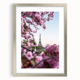 Textured abstract art print depicting spring themes in soft green and yellow tones, framed in silver.