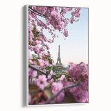 Vintage poster art of spring season on framed canvas, featuring colorful flora against a black background.