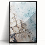Large abstract wall art in mid-century modernist style, featuring swirling blue and orange hues on a framed acrylic print.