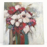 Colorful abstract floral canvas artwork featuring vibrant hues of pink, blue, and green, elegantly leaning against a neutral wall, perfect for modern home decor.