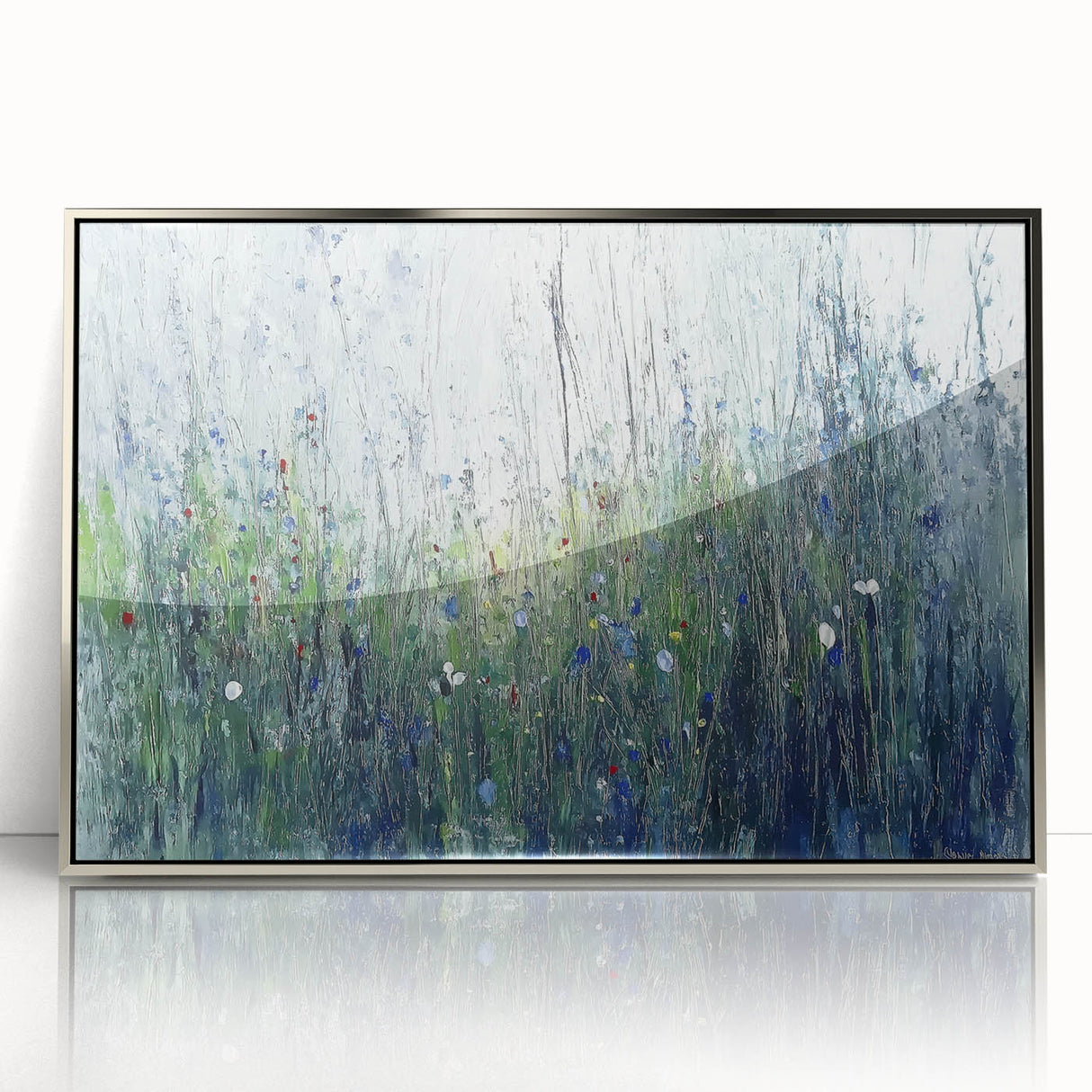 Framed abstract floral artwork in vibrant colors, displayed in a sleek silver frame, perfect for modern home decor. Ideal for adding a touch of elegance to any room.