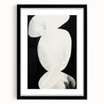 Abstract minimalist wall art framed in black with a white mat, showcasing geometric shapes and soft hues, perfect for modern decor. Ideal for home or office spaces.
