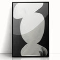 Framed abstract minimalist wall art in a sleek black frame, showcasing a contemporary design with subtle color gradients, perfect for modern home decor.