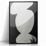 Framed abstract minimalist wall art in a sleek black frame, showcasing a contemporary design with subtle color gradients, perfect for modern home decor.