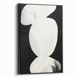 Framed abstract minimalist wall art featuring a black design, viewed from the side, adding a modern touch to any decor. Ideal for contemporary interiors.