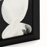 Close-up view of a framed abstract minimalist wall art piece, showcasing soft earth tones and geometric shapes, perfect for modern interior decor.