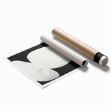 Abstract minimalist wall art print showcasing vibrant blue and orange geometric shapes, elegantly rolled and ready for display in modern interiors.