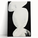 Abstract minimalist wall art on stretched canvas, showcasing soft pastel colors and geometric shapes, leaning against a neutral wall, perfect for modern decor.