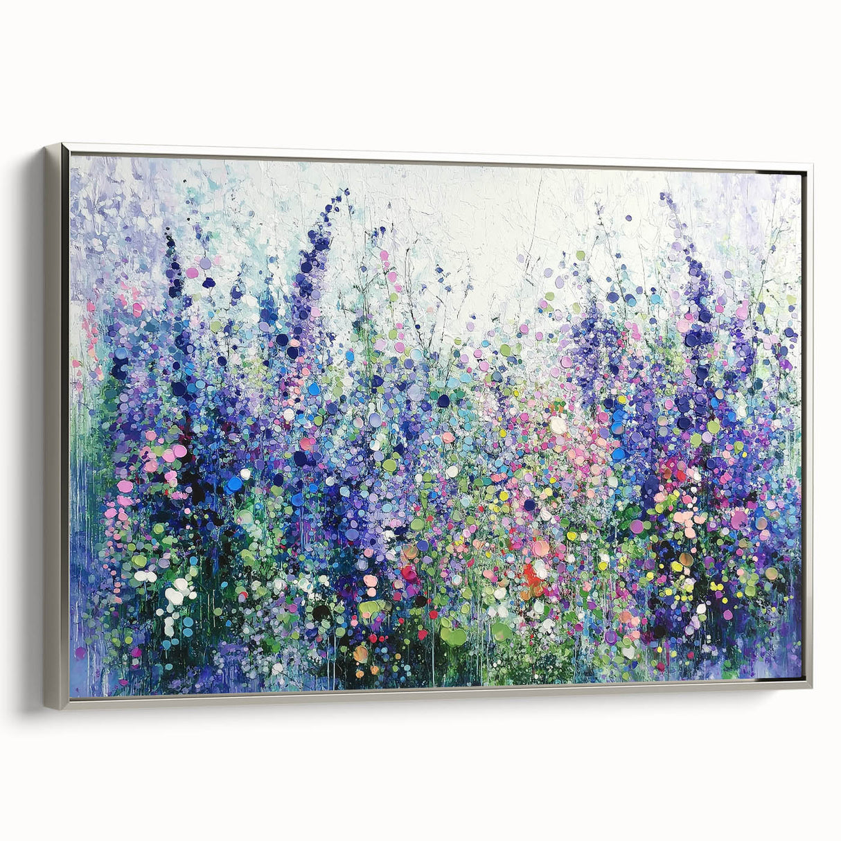 Framed canvas showcasing an abstract floral design in vibrant colors, with a sleek silver frame highlighting its modern aesthetic and artistic appeal. Ideal for contemporary home decor.
