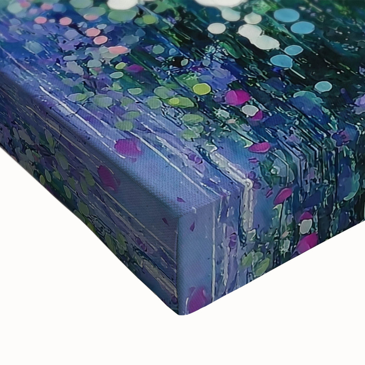 Close-up of an abstract floral stretched canvas featuring vibrant hues of pink, blue, and green, showcasing intricate brush strokes and textures, perfect for modern decor.
