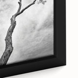 Close-up of a framed canvas artwork featuring vibrant abstract floral designs in rich colors of blue, pink, and gold, adding a modern touch to home decor.