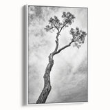 Framed canvas artwork showcasing a vibrant abstract floral design in shades of pink and green, elegantly displayed in a white frame from a side view. Perfect for adding a modern touch to any decor.