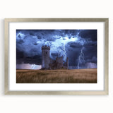 Silver-framed landscape artwork showcasing a picturesque castle scene, elegantly matted for a refined presentation, perfect for home decor enhancement.