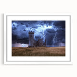 Elegant white-framed landscape artwork showcasing a majestic castle surrounded by lush greenery, perfect for home decor. The matting enhances the sophisticated presentation, making it an ideal centerpiece for any room.