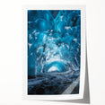 Rolled canvas print showcasing a stunning landscape with intricate cave formations and rich colors, elegantly packaged in a protective cardboard tube for safe delivery.