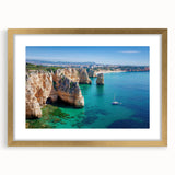 Framed landscape artwork depicting dramatic cliffs with a gold mat, showcasing vibrant colors and intricate details, ideal for home decor and art enthusiasts.
