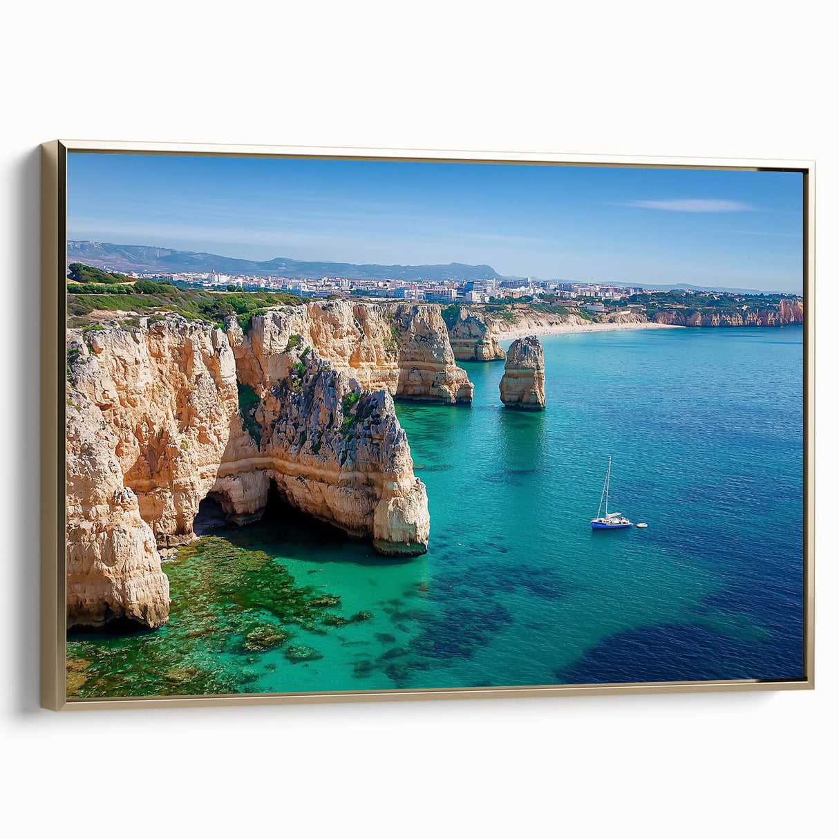 Framed canvas art depicting a stunning landscape with dramatic cliffs and a serene sky, featuring a gold side frame that enhances its elegance, perfect for home decor.