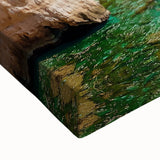 Close-up view of a vibrant stretched canvas artwork depicting dramatic coastal cliffs, showcasing rich colors and intricate textures, perfect for enhancing any decor.