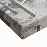 Close-up of a vibrant abstract architectural wall art piece on stretched canvas, showcasing intricate geometric patterns in shades of blue, yellow, and gray, perfect for modern home decor.