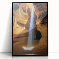 Framed acrylic art piece showcasing a stunning landscape of canyons with rich earth tones, featuring a sleek black frame, perfect for modern home decor.