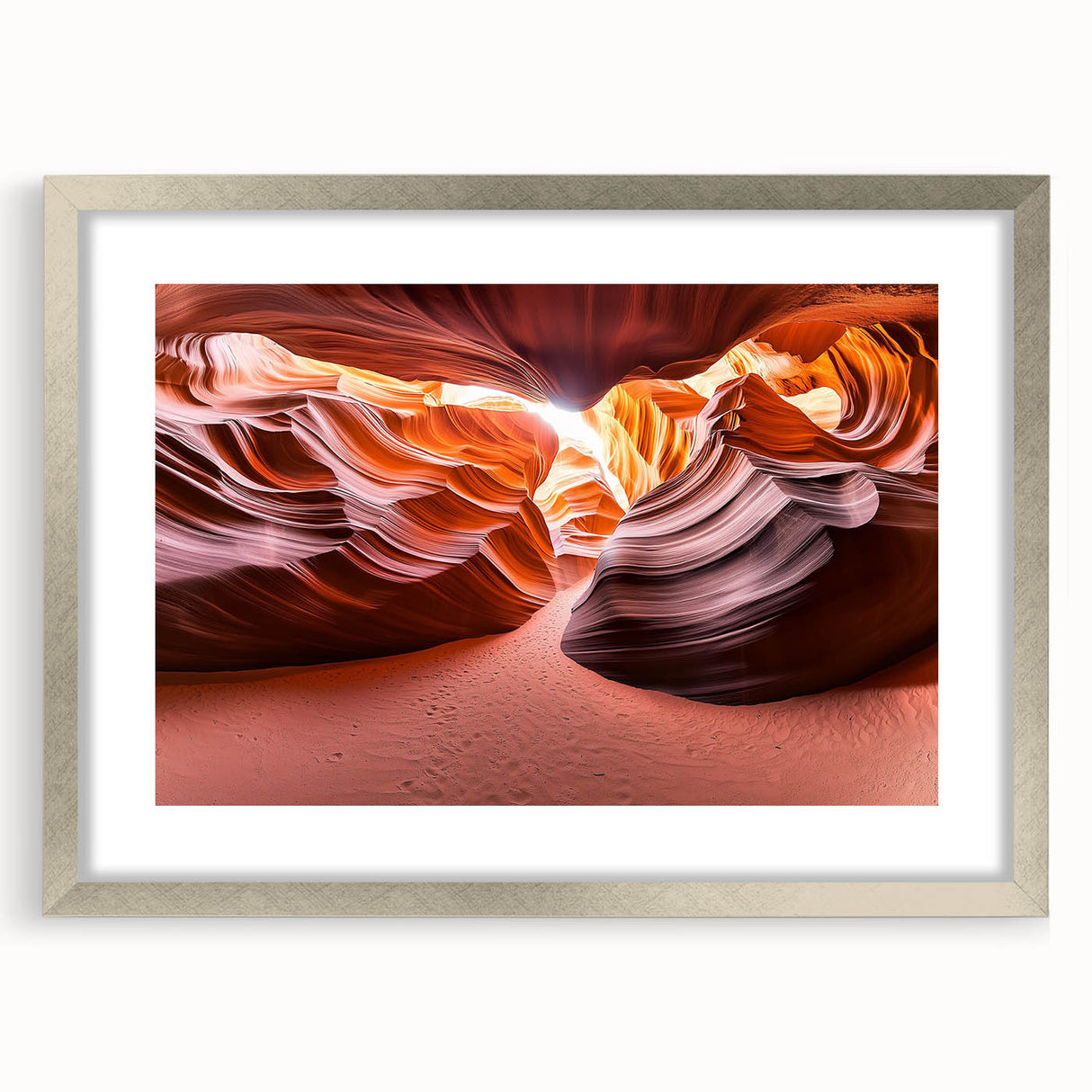 Silver-framed desert landscape artwork with a white mat, showcasing vibrant colors and intricate details, perfect for enhancing home decor.