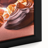 Framed canvas artwork depicting a serene desert landscape with warm hues of orange and yellow, showcasing detailed textures and natural elements, perfect for home decor.