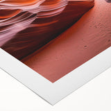 Desert landscape rolled canvas art showcasing vibrant orange and yellow hues with textured details, elegantly packaged in a protective cardboard tube for display.