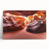 Desert landscape stretched canvas art showcasing vibrant orange and beige hues, leaning against a neutral wall, perfect for modern home decor accents.