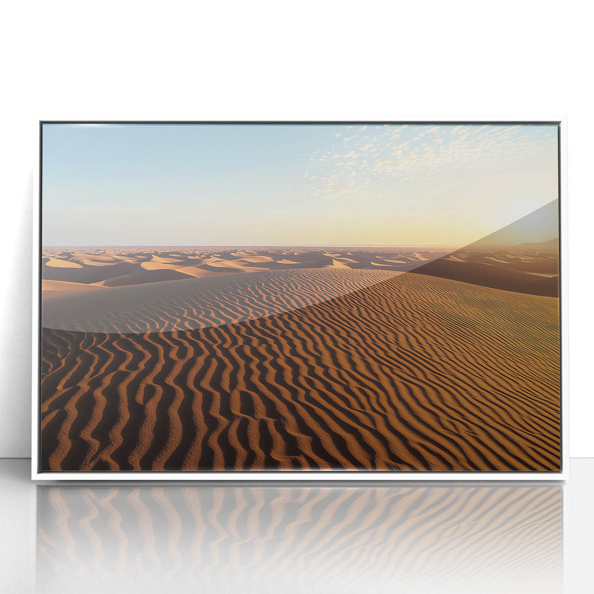Framed acrylic artwork showcasing a serene landscape of rolling sand dunes, highlighted by soft earthy tones and a crisp white frame, perfect for modern decor.