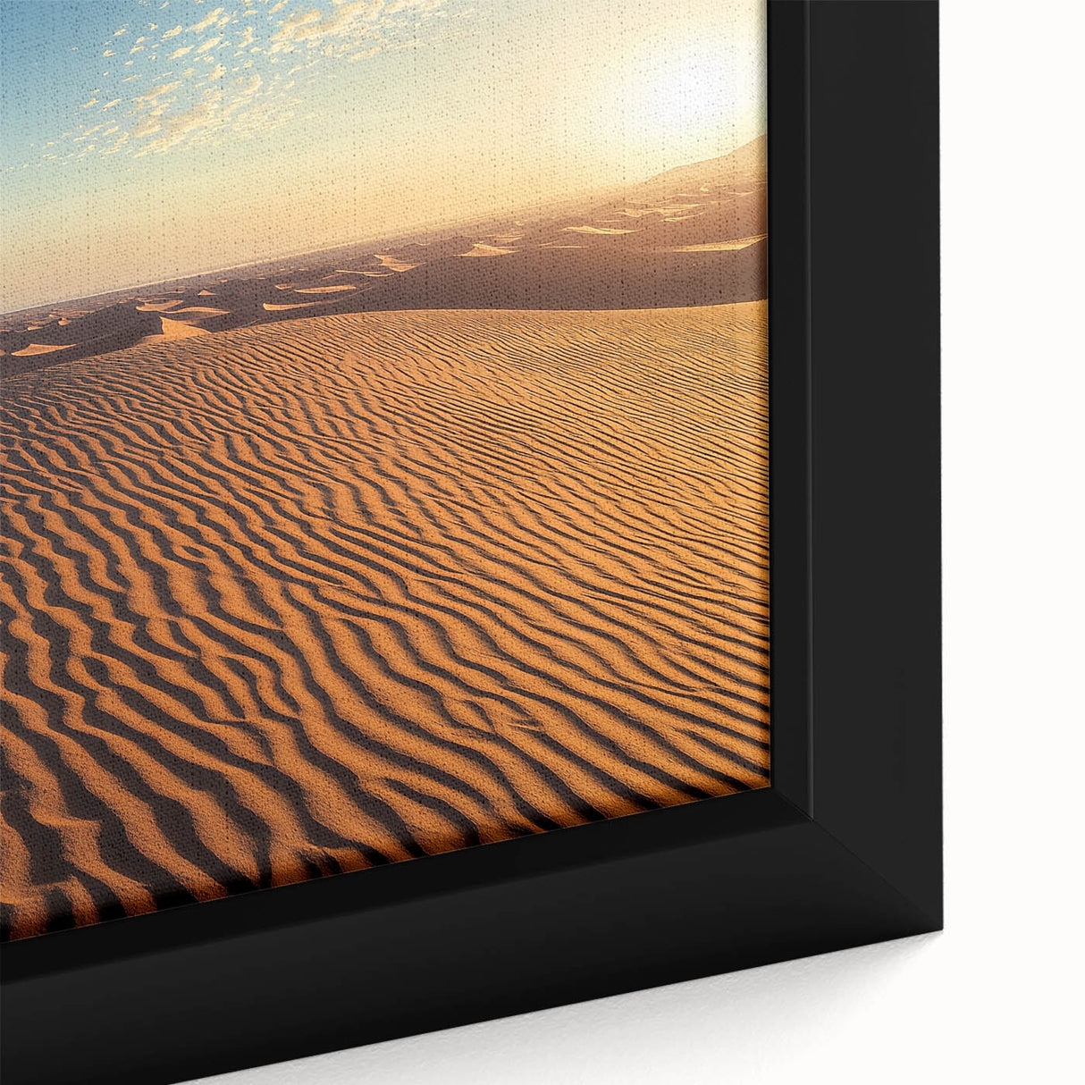 Close-up of a framed canvas showcasing a serene desert landscape with golden dunes under a vibrant blue sky, highlighting intricate textures and rich colors. Perfect for home decor, this artwork adds a touch of natural beauty to any space.