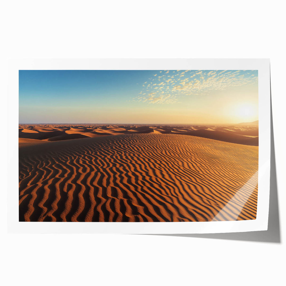 Stunning landscape print of rolling sand dunes at sunset, showcasing vibrant orange and purple hues, rolled and ready for framing or display in a modern home.